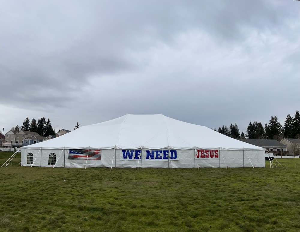 Tent revival gathering at twilight
